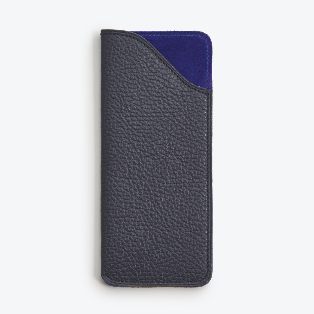 Luxury leather glasses case Navy and Royal Blue with a green suede lining, closed and standing upright.